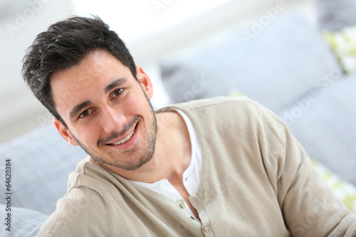 Portrait of young man relaxing at home