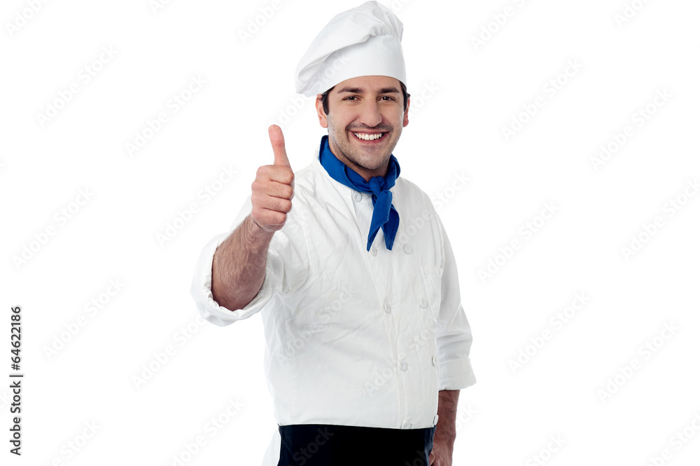 Young chef showing double thumbs up