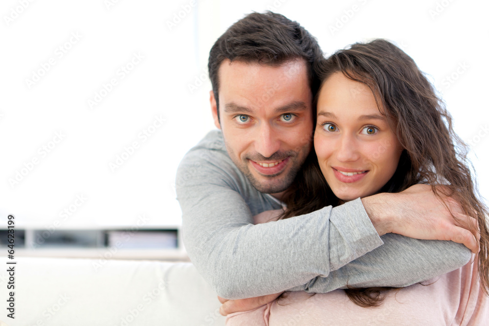 Fototapeta premium Portrait of a young happy couple