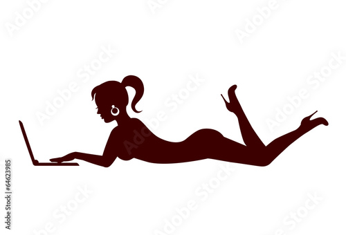 silhouette of a lying woman with a laptop