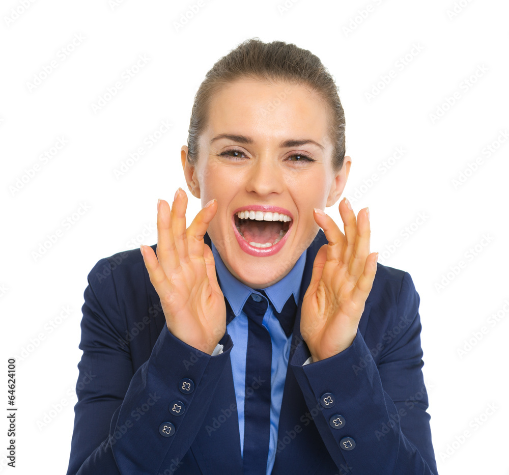 Happy business woman shouting through megaphone shaped hands Happy business woman shouting through megaphone shaped hands