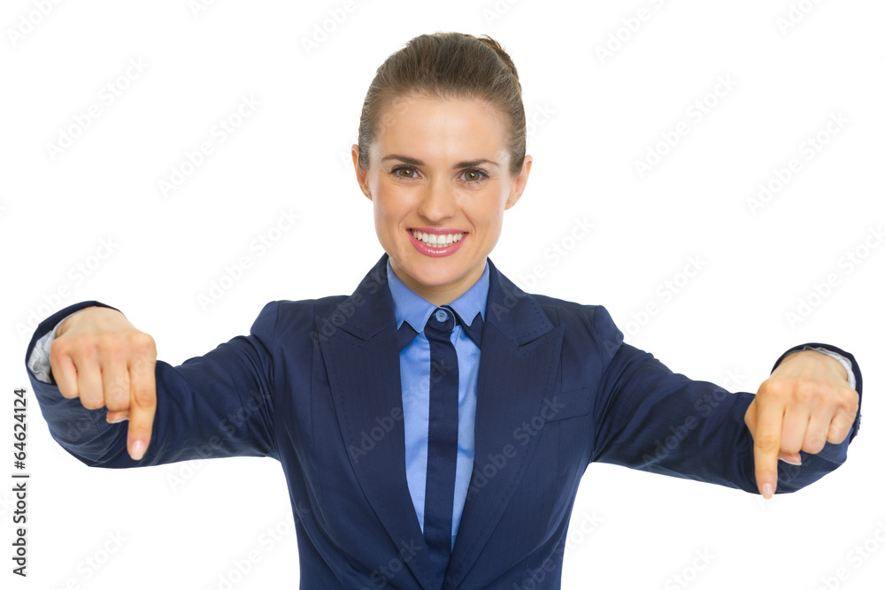 Smiling business woman pointing down on copy space Smiling business woman pointing down on copy space