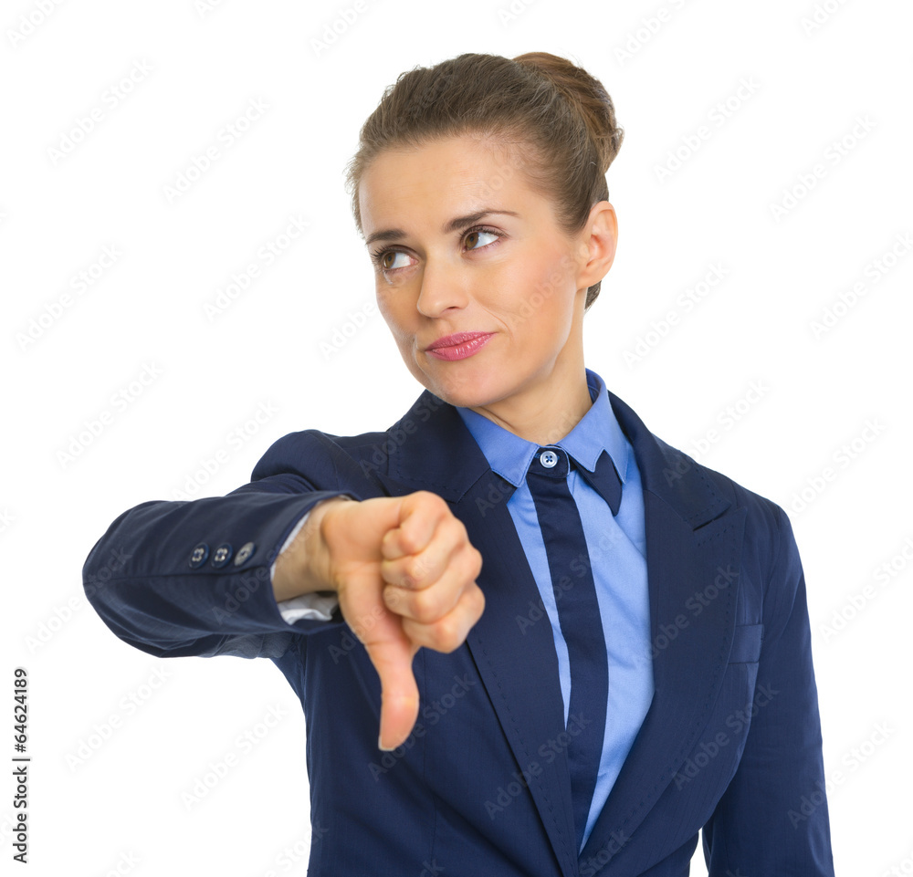 Displeased business woman showing thumbs down Displeased business woman showing thumbs down