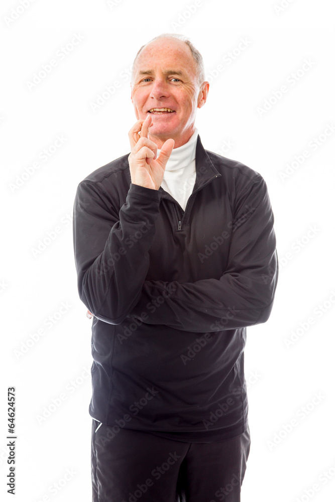 Senior man standing with finger crossed for luck Senior man standing with finger crossed for luck