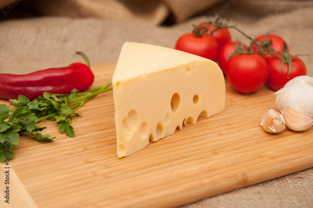 cheese and vegetables on wooden board cheese and vegetables on wooden board