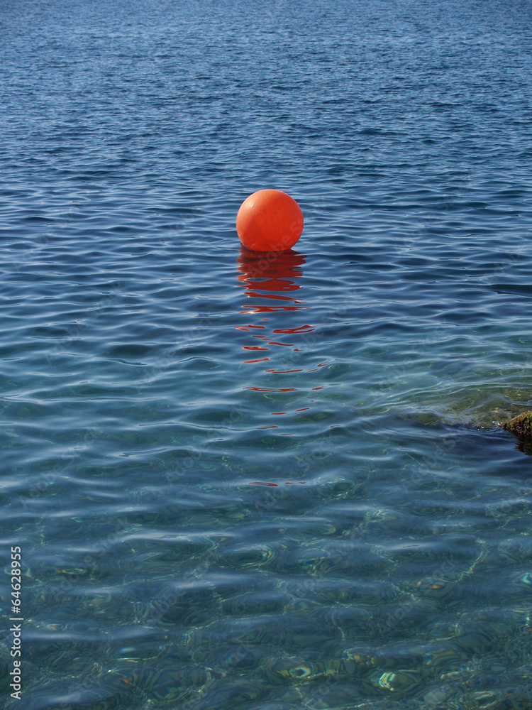 The anchor buoy lies on a sea surface