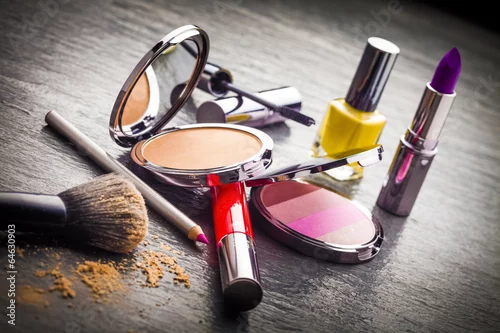 Obraz Cosmetics on black slate background