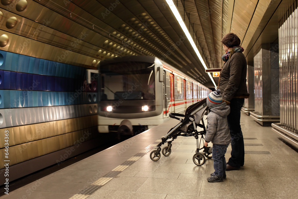 Fototapeta premium Mother with son at subway station