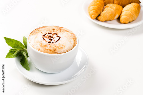 Fototapeta Naklejka Na Ścianę i Meble -  large cup of coffee and croissants on a plate