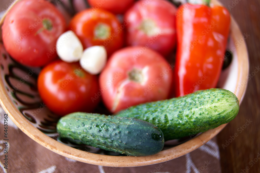 Tomato,cucumber and paprika on the old plate Tomato,cucumber and paprika on the old plate