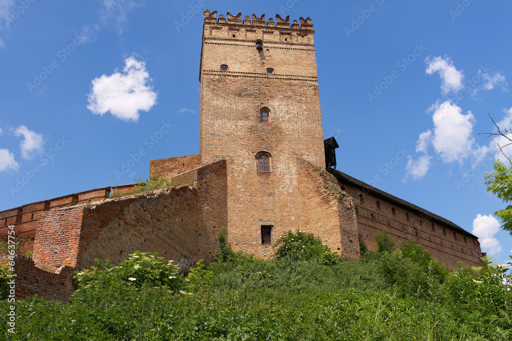 Old castle tower under blue sky