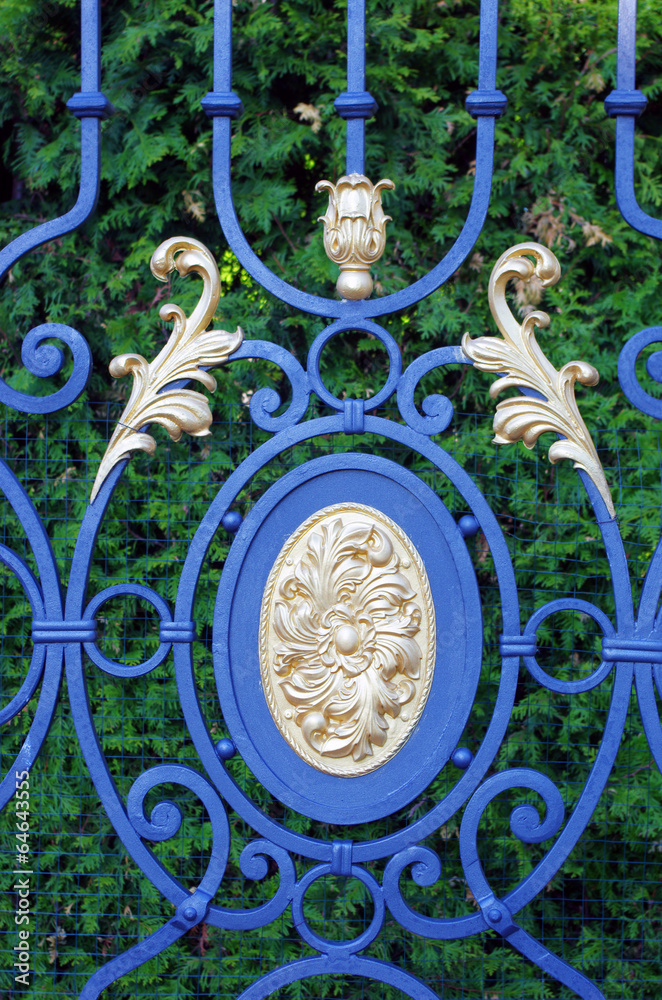 Forged gates with leaves and gilding