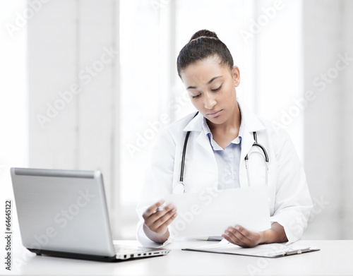 female doctor with laptop pc