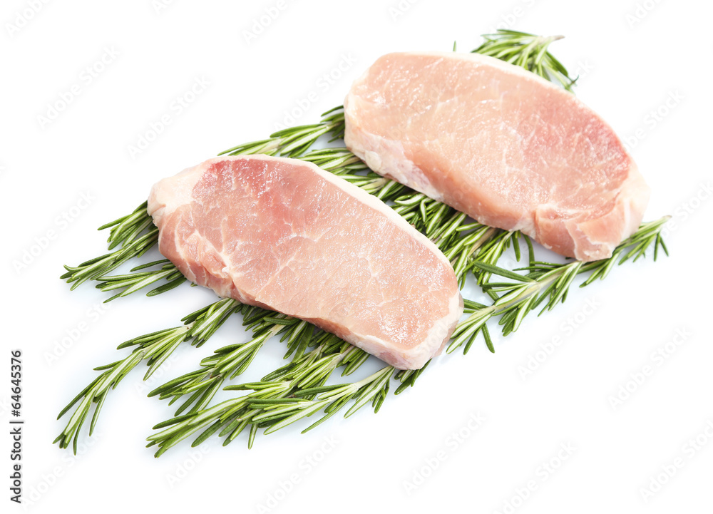 Raw meat steak with herbs isolated on white Raw meat steak with herbs isolated on white