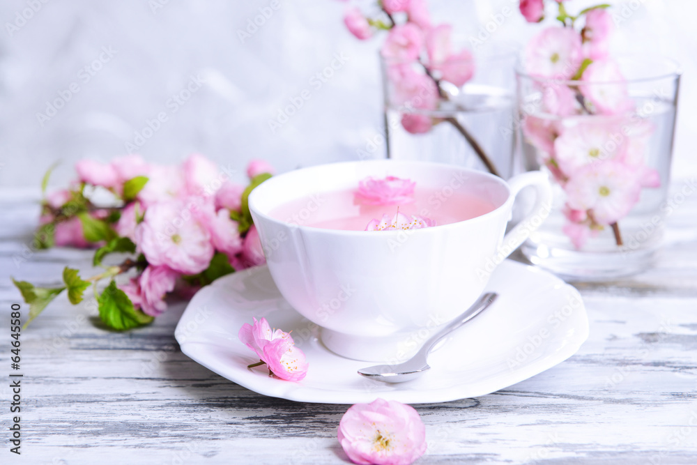 Beautiful fruit blossom with cup of tea Beautiful fruit blossom with cup of tea