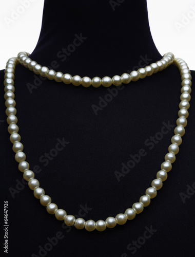 necklace type pearl on black mannequin isolated on white