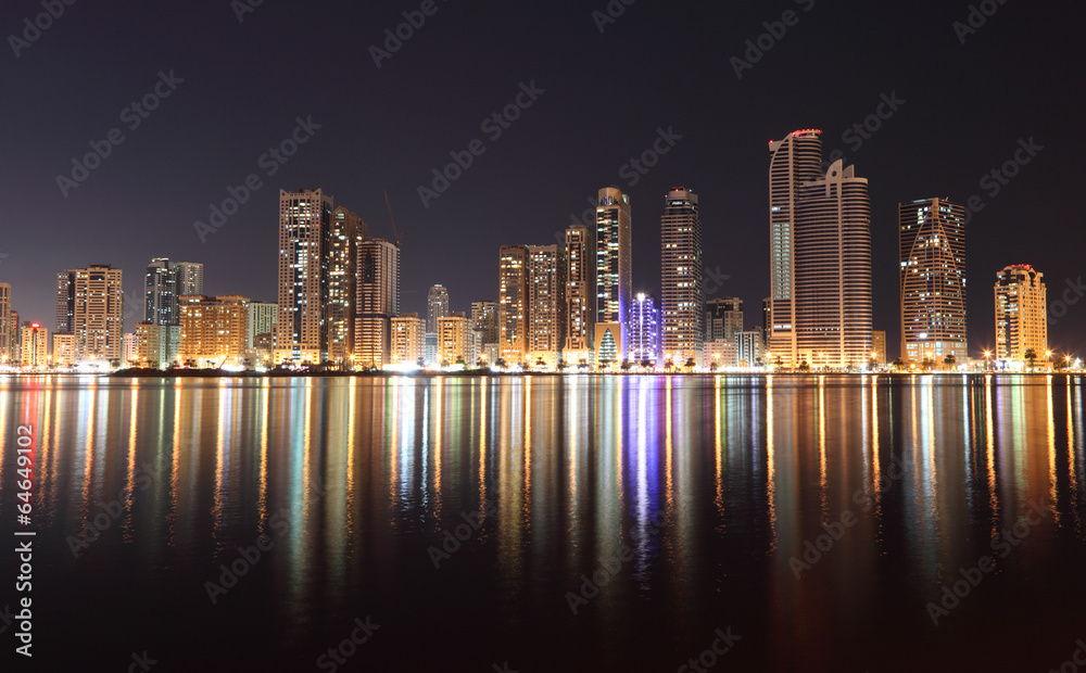 Naklejka premium Skyline of Sharjah City at night, United Arab Emirates