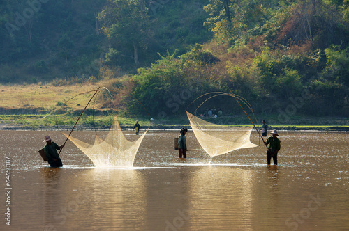 People catch fish by lift net on ditch photo