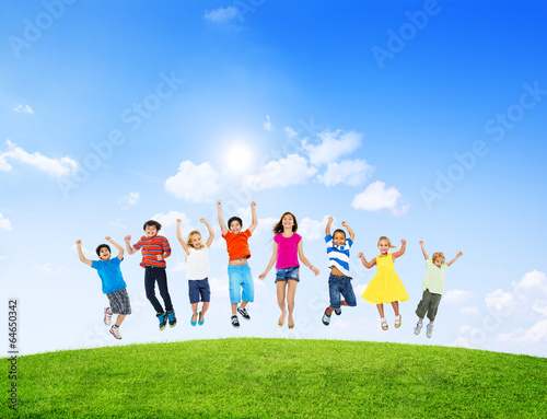 Group of Diverse Children Jumping Outdoors