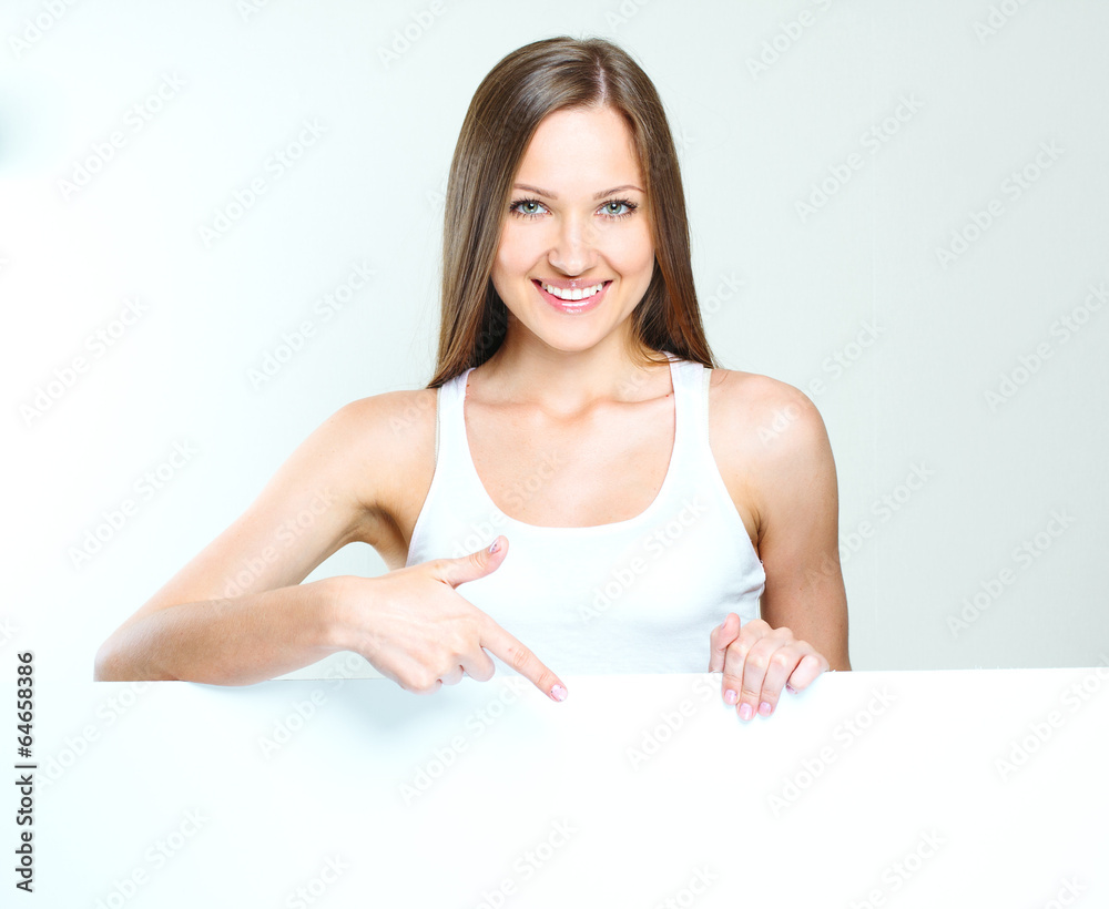 woman standing and holding big blank paper. woman standing and holding big blank paper.