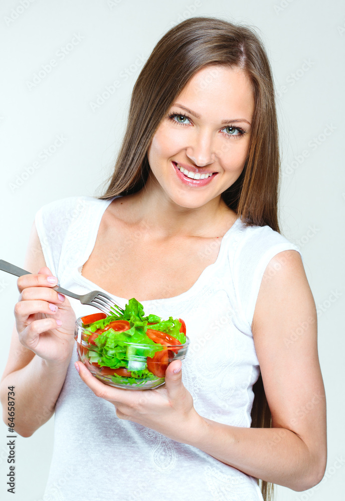 woman eating salad with vegetables. healthy food. woman eating salad with vegetables. healthy food.