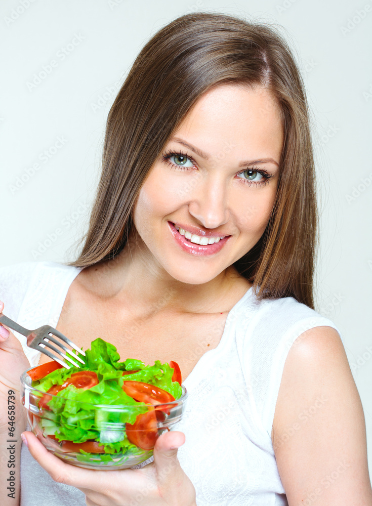 woman eating salad with vegetables. healthy food. woman eating salad with vegetables. healthy food.