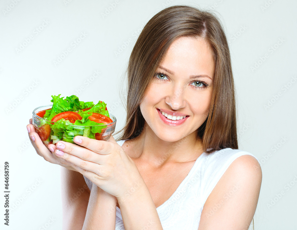 woman eating salad with vegetables. healthy food. woman eating salad with vegetables. healthy food.