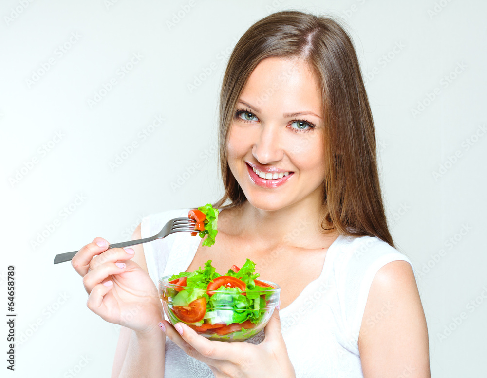woman eating salad with vegetables. healthy food. woman eating salad with vegetables. healthy food.