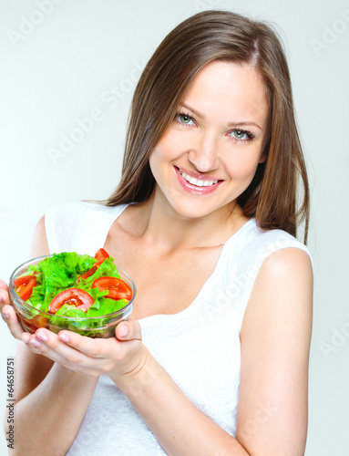 woman eating salad with vegetables. healthy food.