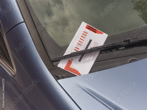 parking ticket on a car windshield