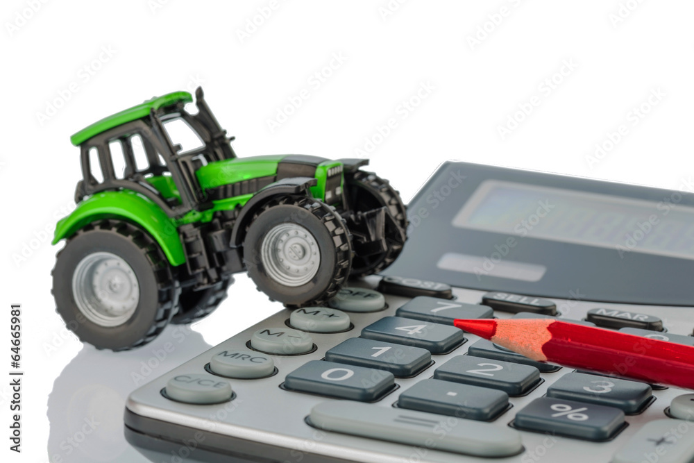 Naklejka premium tractor, red pen and calculator