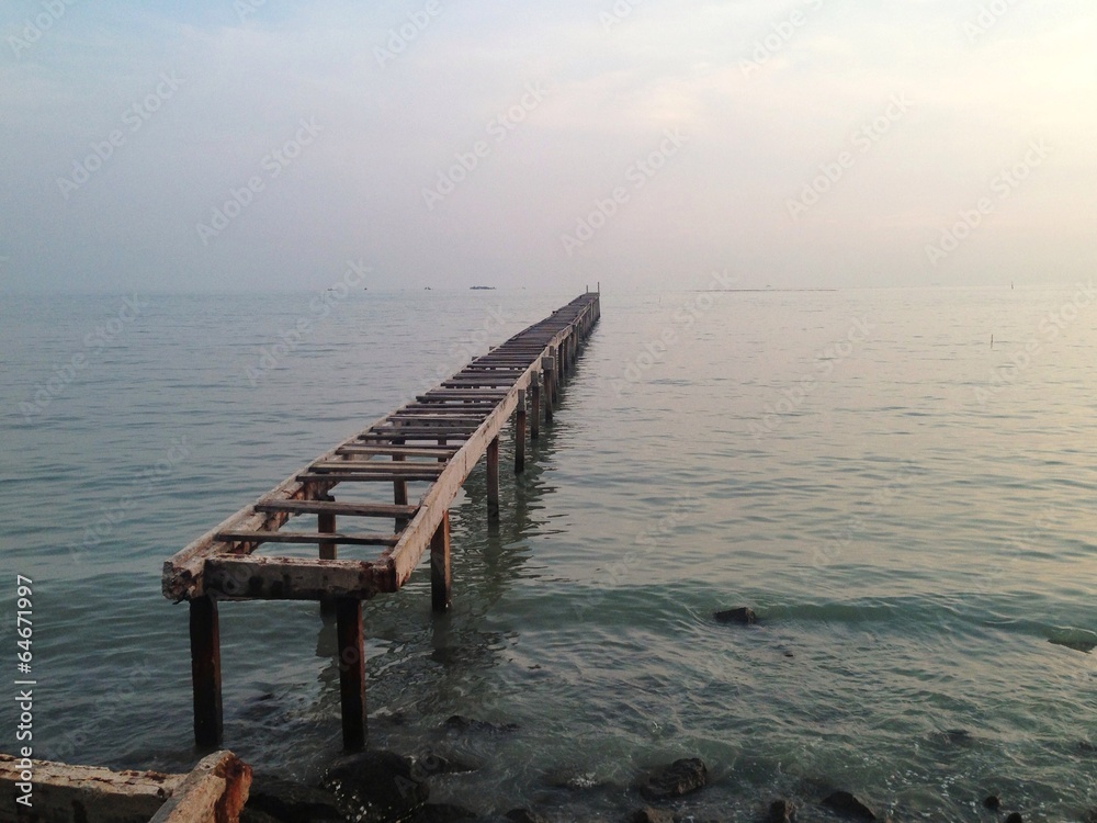 old broken pier lead to open sea