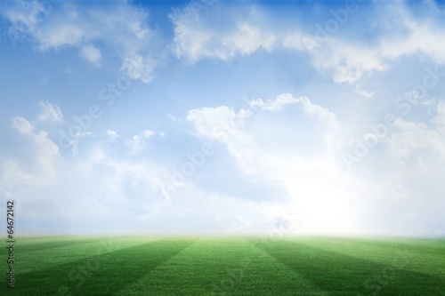 Football pitch under blue sky