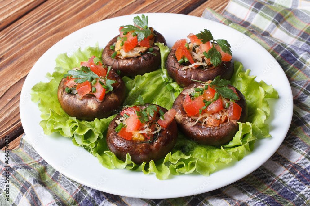 Appetizer of mushrooms stuffed with vegetables on lettuce Appetizer of mushrooms stuffed with vegetables on lettuce