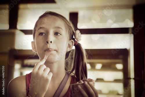 Little girl eating ice cream photo