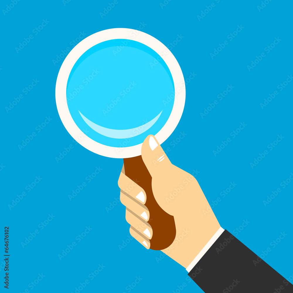 Magnifying icon in a hand Magnifying icon in a hand