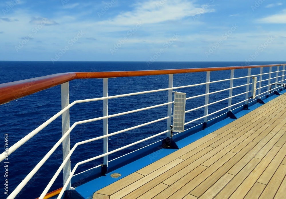Cruise ship deck and rail overlooking the sea Cruise ship deck and rail overlooking the sea