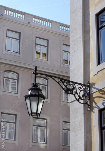 Old lantern hanging on the street of historical center of Lisbon