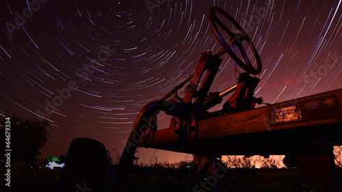 Circles of time - timelapse with night startails and old traktor photo