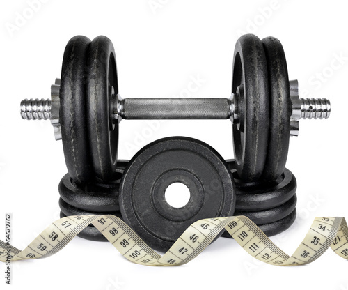 Black dumbbell with measuring tape isolated on white