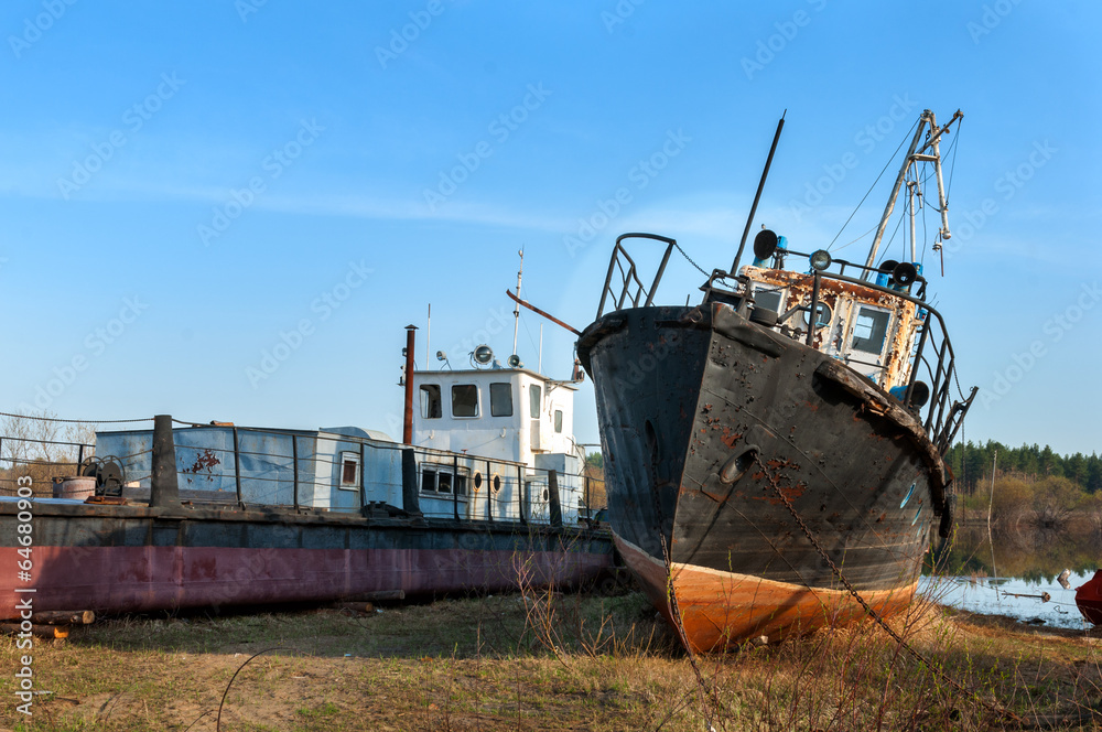 broken rusty ships standing on the river bank broken rusty ships standing on the river bank