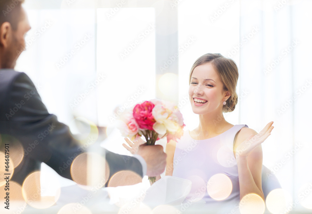 amazed woman recieving bouquet of flowers