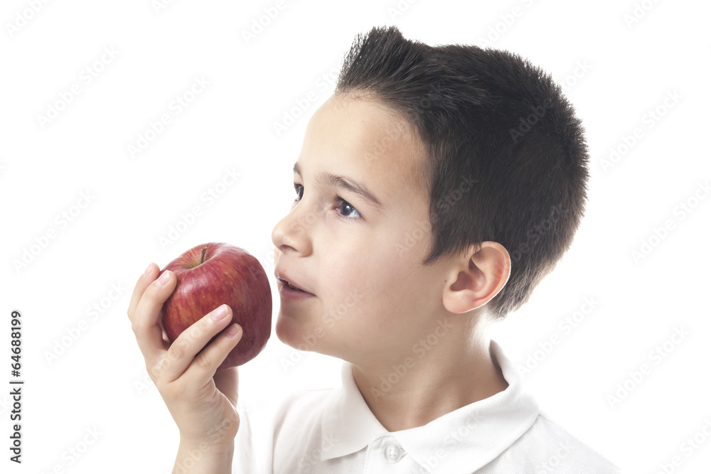 Child with apple looking upwards. Child with apple looking upwards.