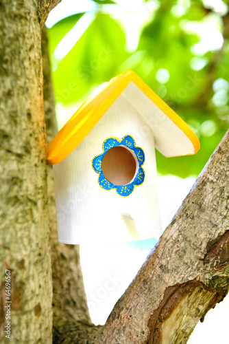 Birdhouse in garden outdoors © Africa Studio