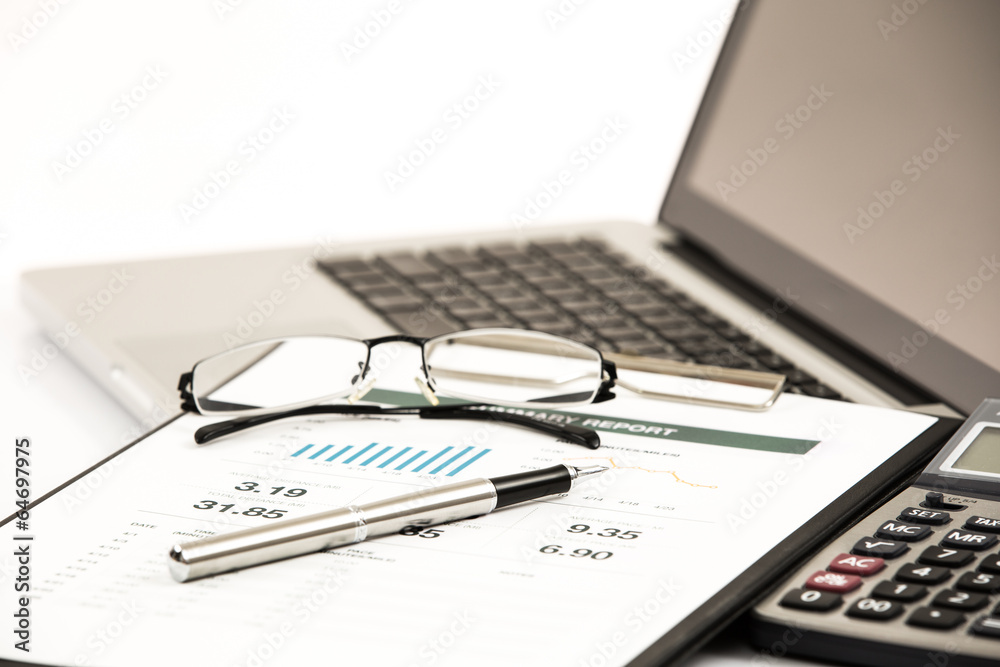 Businessman analyzing investment charts on laptop Businessman analyzing investment charts on laptop