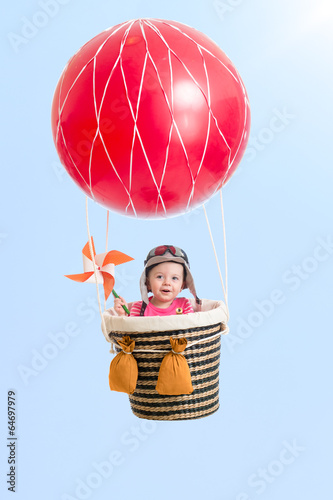 cheerful kid on hot air bal...
