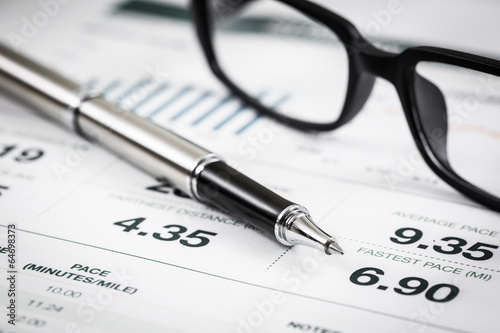 closeup glasses on financial report