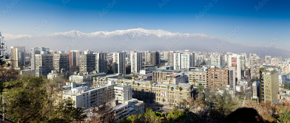 Aerial view of a city and The Andes mountain in the background,