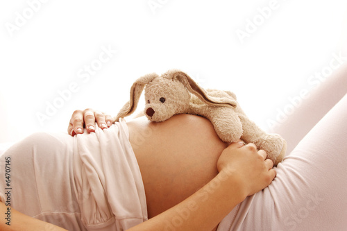 pregnant woman on a white background photo