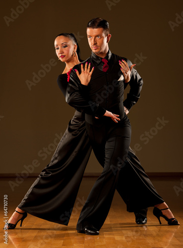  Professional ballroom dance couple preform an exhibition dance photo